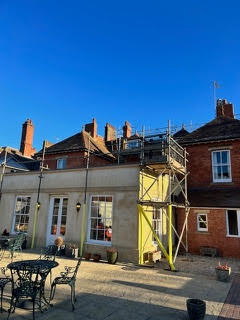 Scaffolded roofing works on a period property, Dorset